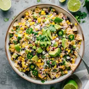 Creamy Mexican street corn pasta salad recipe card with fresh ingredients and easy-to-follow instructions.