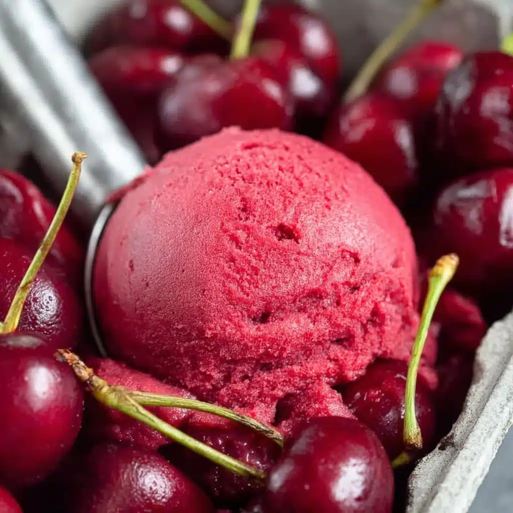 Fresh Cherry Sorbet served in a bowl with mint and lime zest